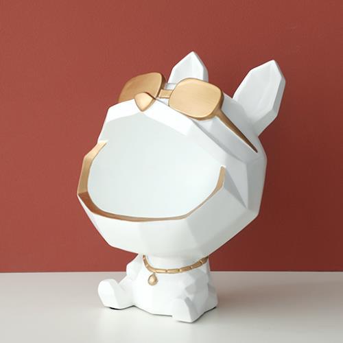 White faceted dog figure with gold-tone sunglasses on its forehead and an empty open mouth