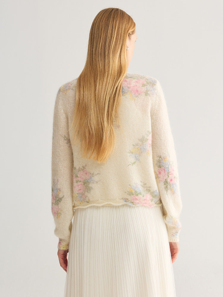 Floral jacquard V-neck cardigan with pearl-look buttons, cream base with pastel floral print, back view on model wearing
