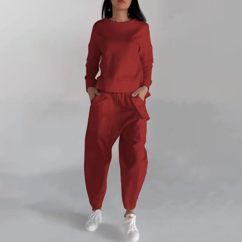 Red round-neck sweatshirt and jogger trousers set, front view on model