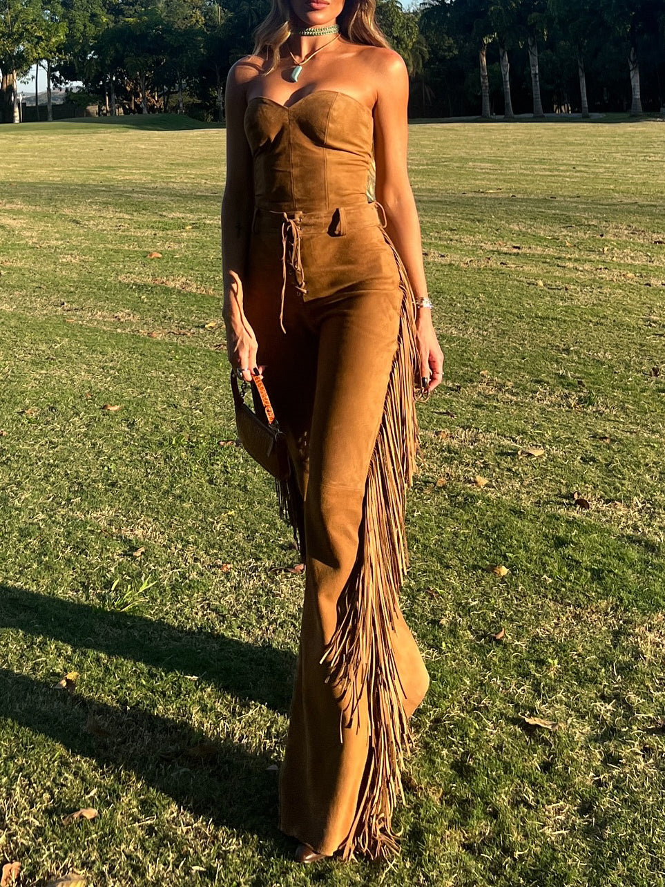 Faux suede strapless top and fringe flared trousers set, camel, on model in park, front view
