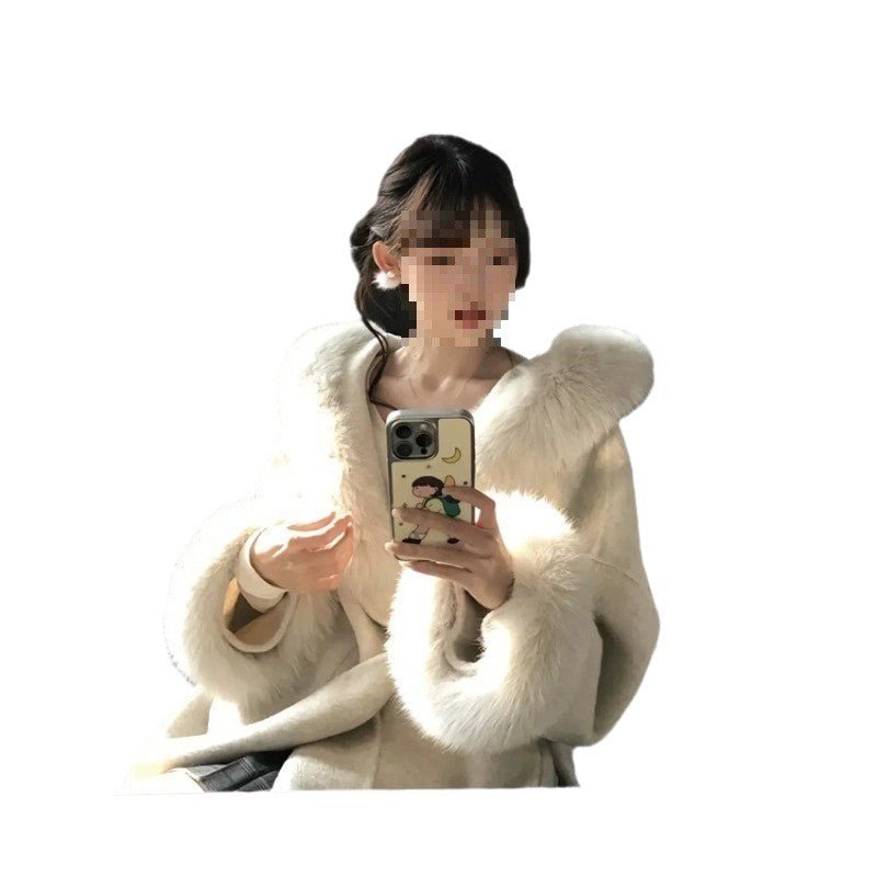 Mirror selfie in the cream coat with deep faux-fur cuffs