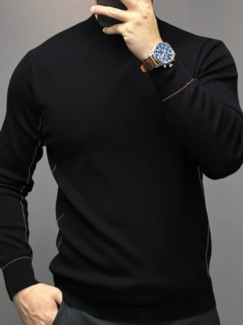 Crew-neck sweater in black with contrast stitching on sleeves, worn by a model from front view