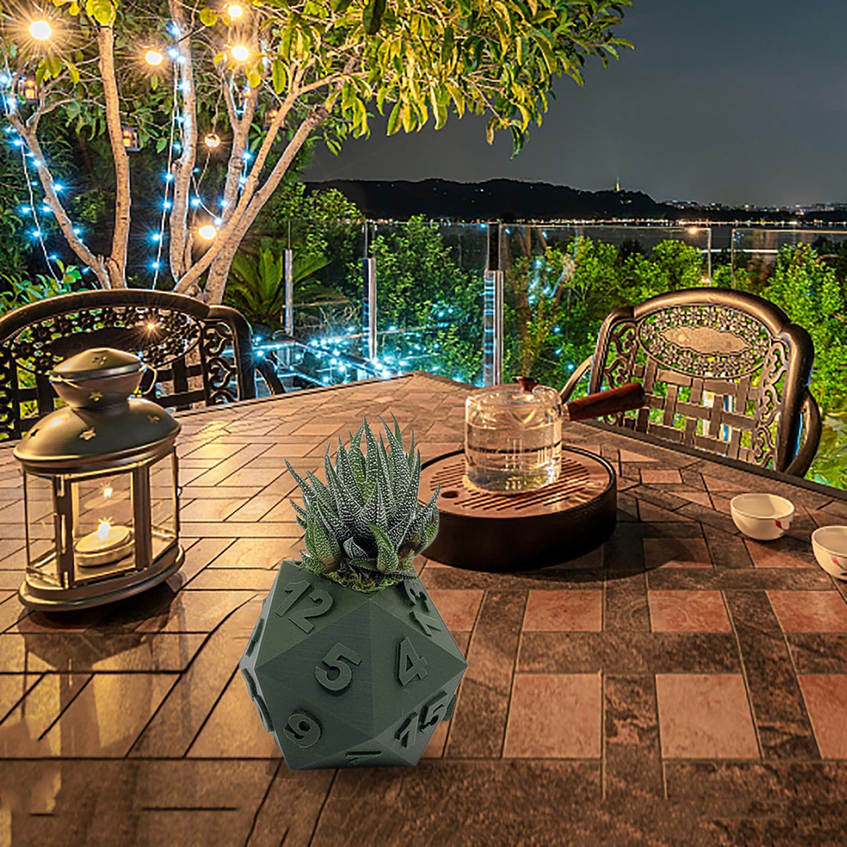 Multi-Sided Dice-Shape Succulent Planter in green, with numbers and succulent plant, on wooden table outdoors at night