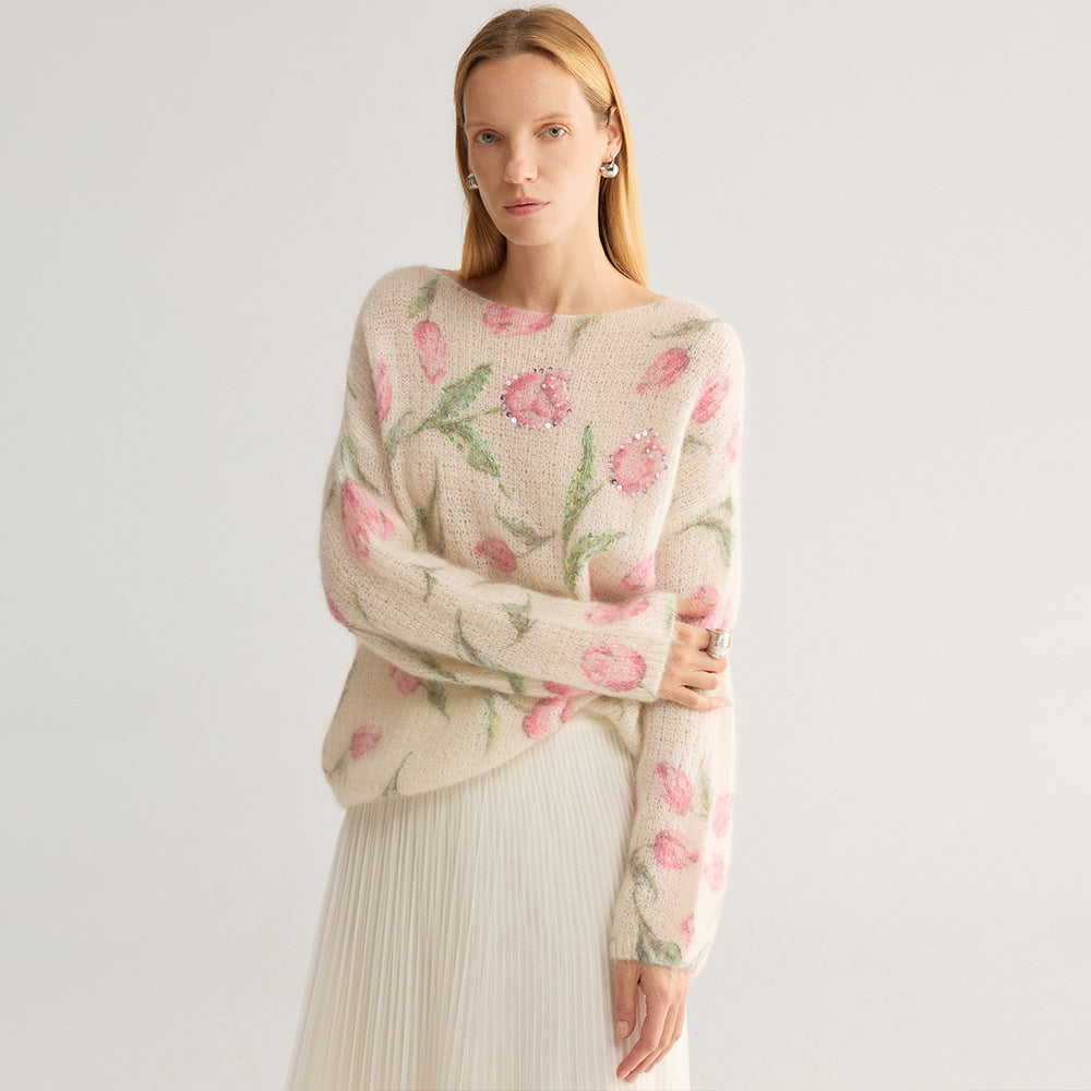 Tulip and floral print fuzzy knit jumper, wide neck, cream with pink flowers, front view on model, arms crossed, studio