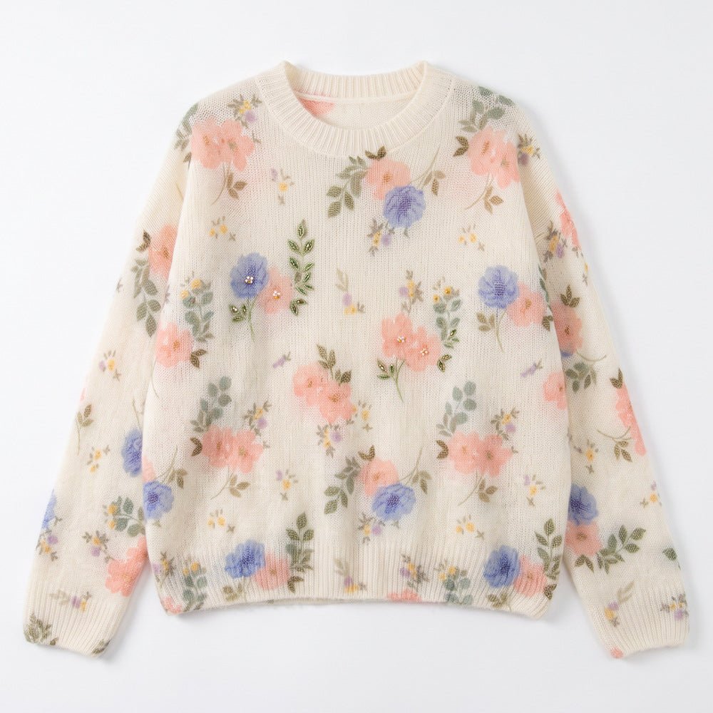 Ivory wildflower jumper laid flat, small scattered pink and blue flowers with green leaves