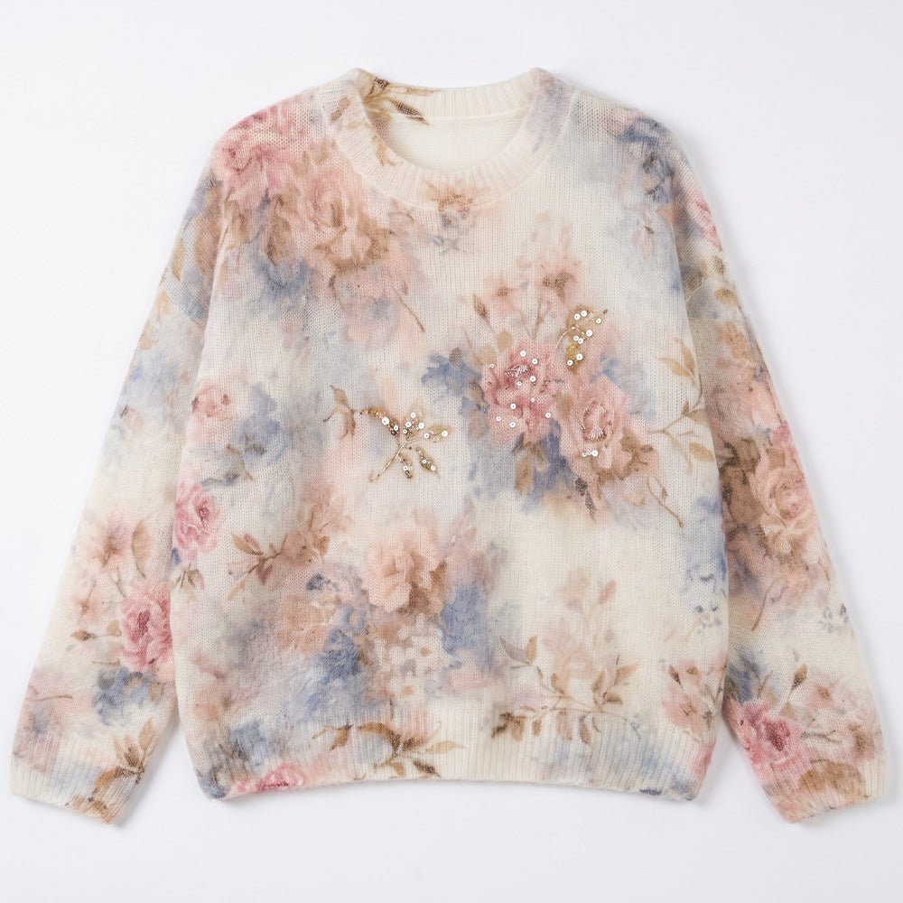 Grey-pink floral jumper laid flat, pink and blue roses with a cluster of small beads