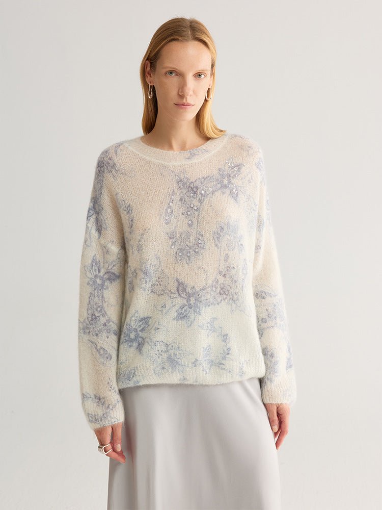 Model facing the camera in the blue floral jumper, hem at the hip