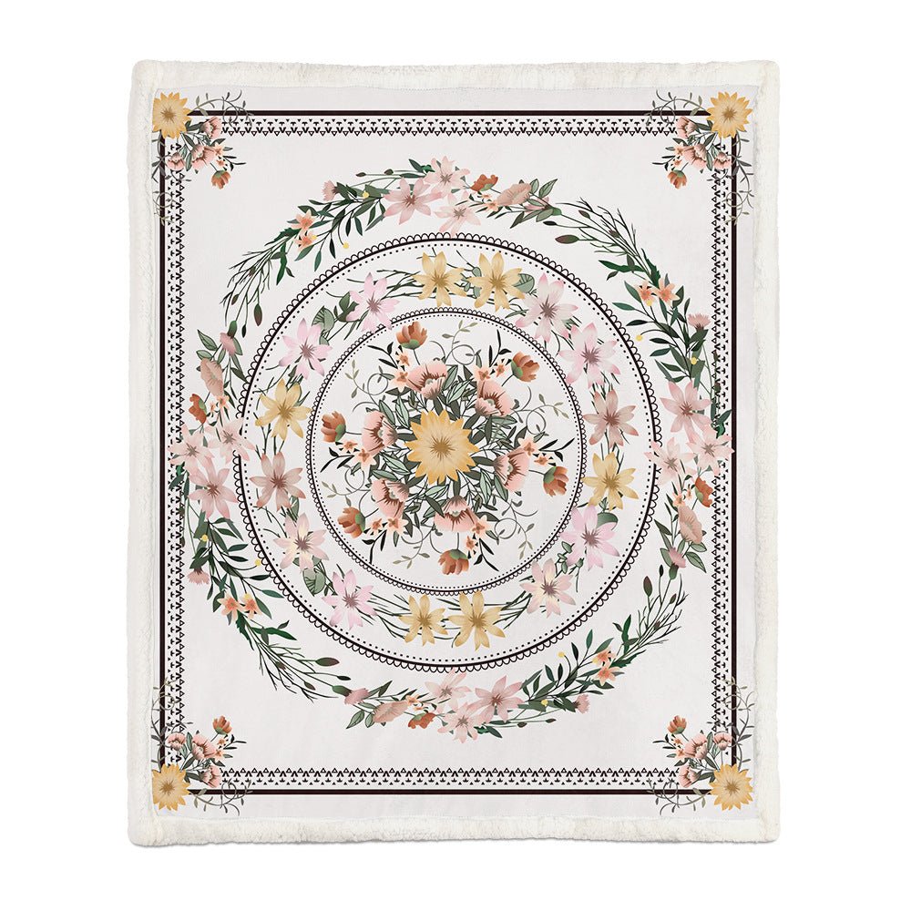 White throw with a pink and yellow flower medallion