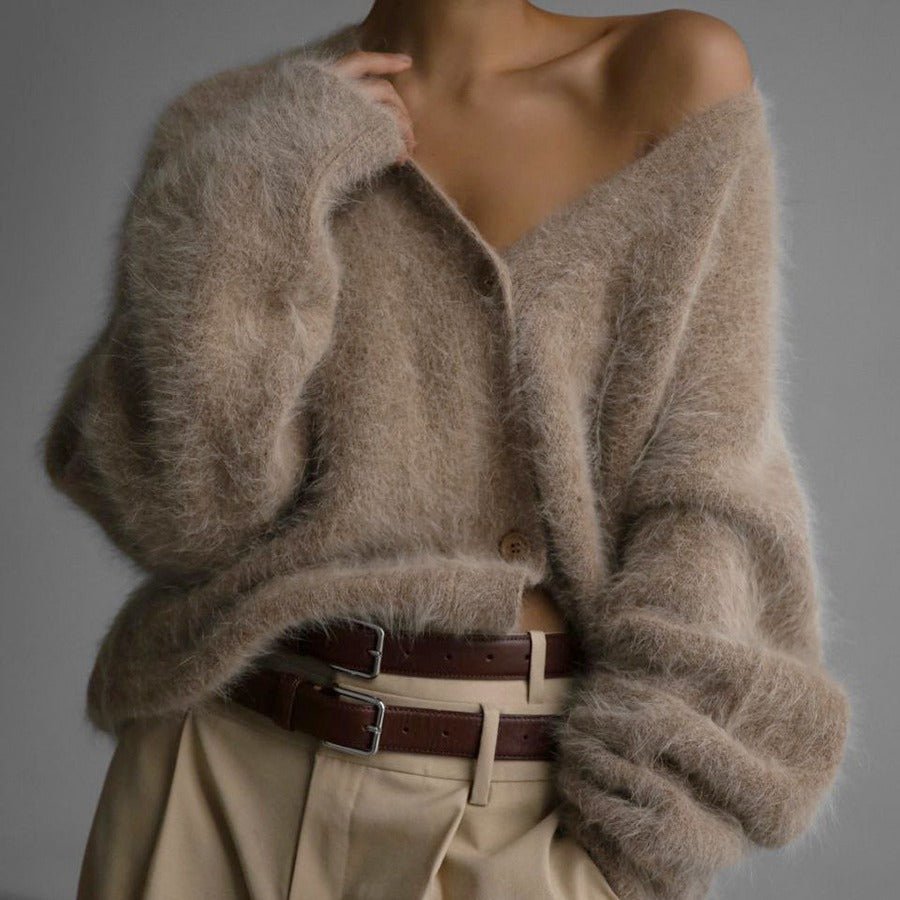 Fluffy oversized V-neck cardigan in beige, front view on model, button front, paired with wide pants and brown belt