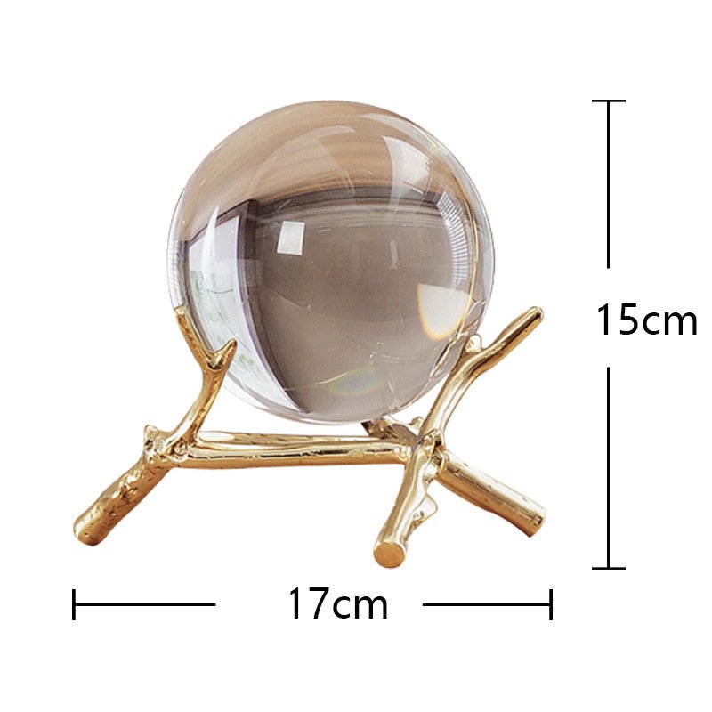 Clear glass ball on the low gold-tone branch stand, marked 15 cm high and 17 cm wide