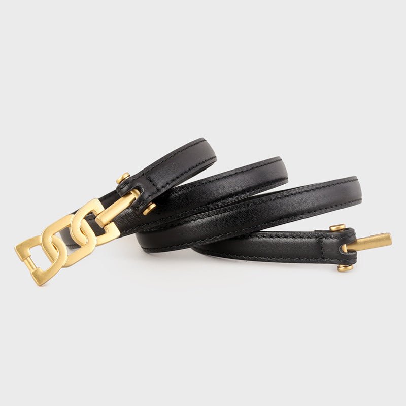 Gold buckle on slim black leather belt, genuine cowhide texture, polished metal closure — Gold Buckle Skinny Leather Belt acc