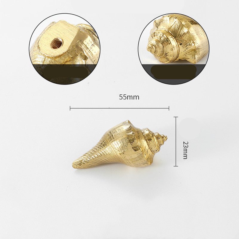 Gold-tone cabinet knob shaped like a conch shell, 55 mm wide and 23 mm high, with close-ups of the screw hole