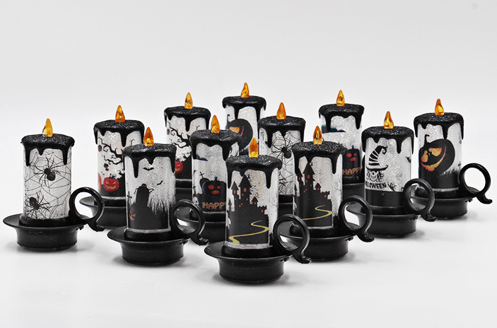 Group of unlit candles on white showing the different black and white Halloween prints
