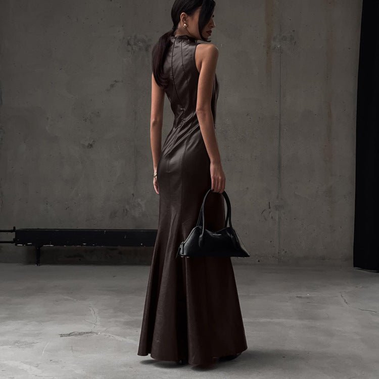 Back view of the sleeveless brown maxi dress with the hem flaring to the floor