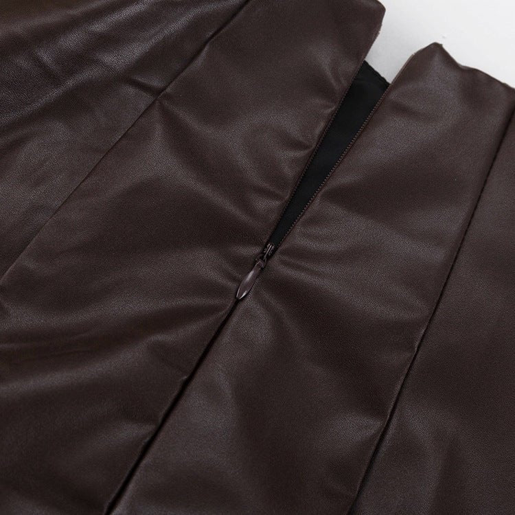 Close-up of the zip at the centre back of the brown dress