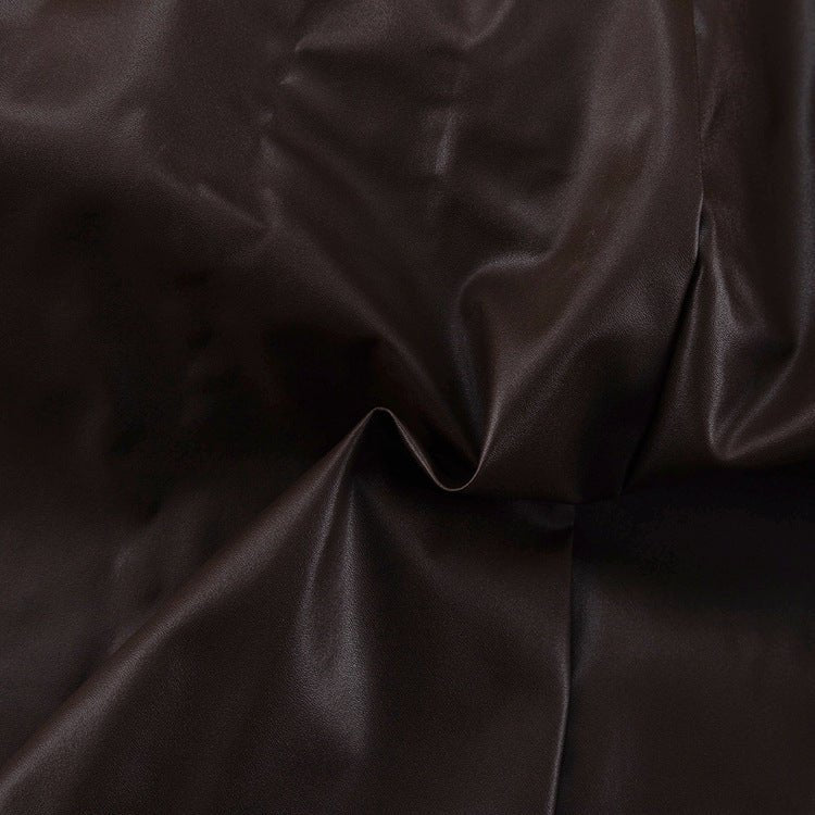 Close-up of the glossy brown surface and a panel seam