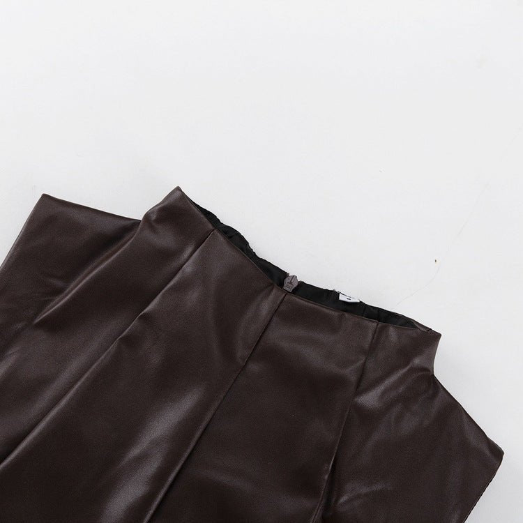 Collar of the dress laid flat with the zip pull at the back