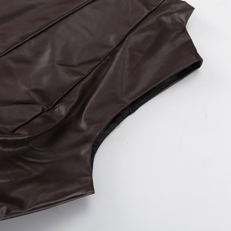 Sleeveless armhole and shoulder of the brown dress, close-up