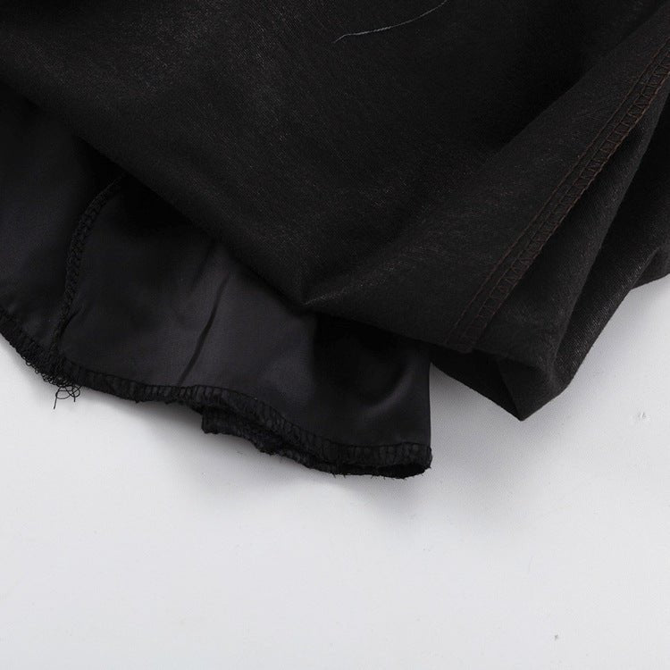 Close-up of the hem showing the black reverse side of the fabric