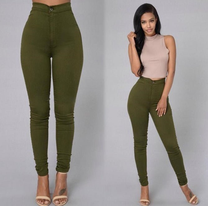 Olive green skinny trousers worn with a nude crop top and heeled sandals