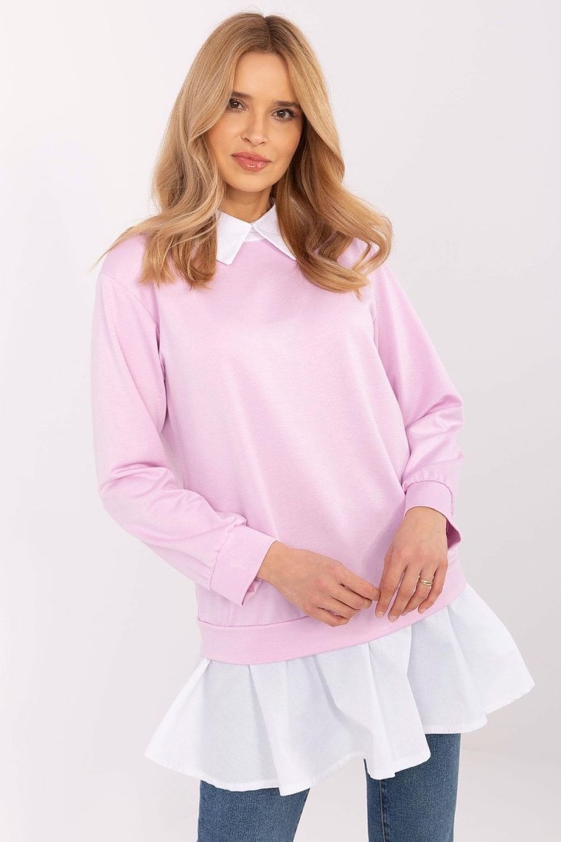 Woman wearing a long-sleeved blouse with ruffled sleeves and high neckline | Elegant Ruffle Sleeve Blouse