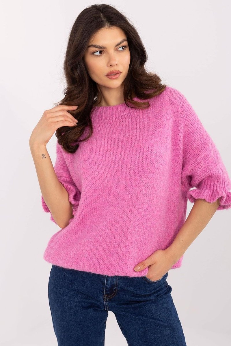 Cozy soft knit jumper in neutral tone with ribbed hem and cuffs, showcasing Italian craftsmanship and relaxed fit silhouette