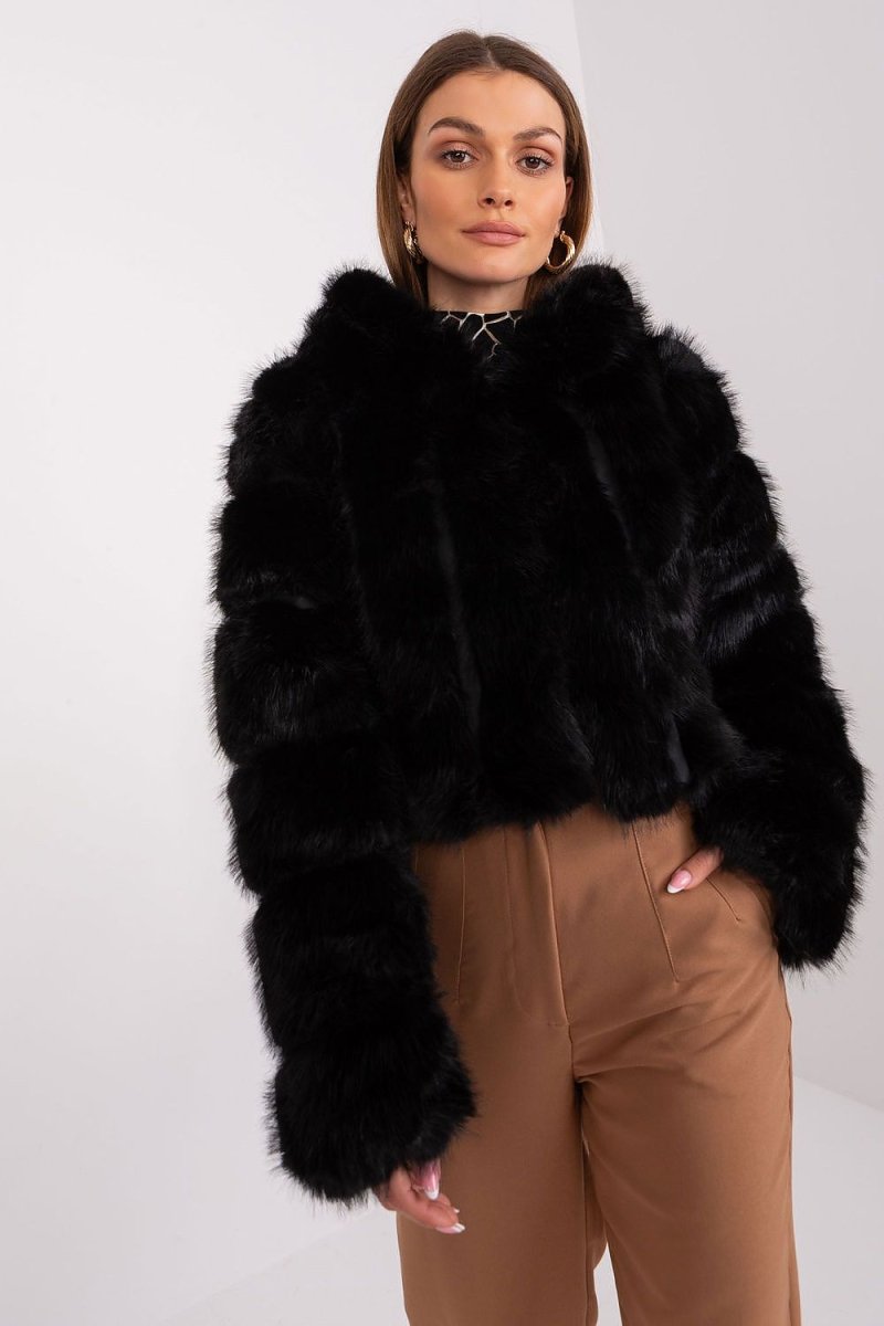 Black elegant transitional jacket by AT with structured shoulders and minimalist closure — perfect fall winter fashion layer