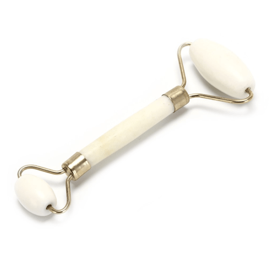 Side view of the jade facial massage roller with white rollers and gold-colored metal frame against a white background