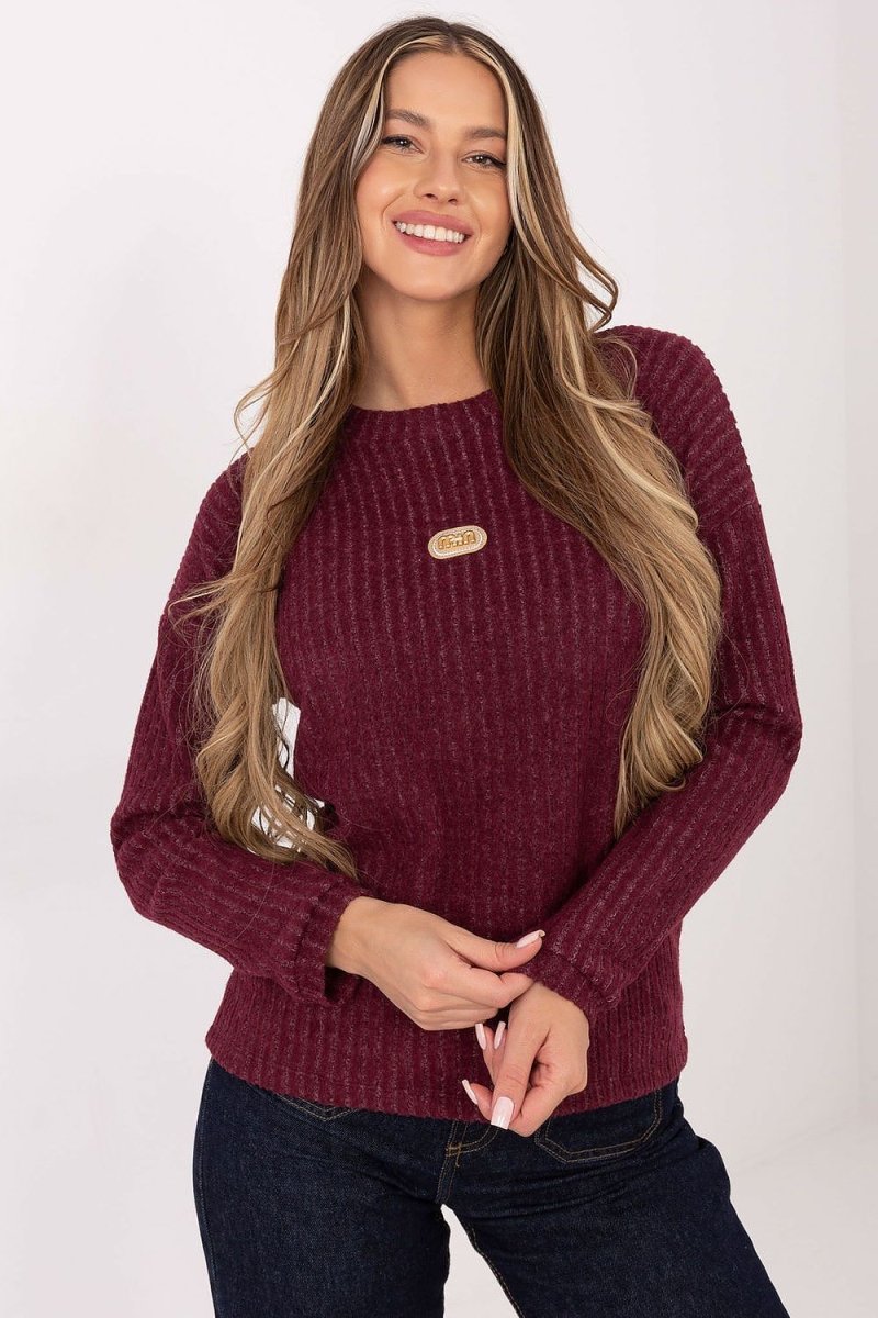 Women's wool jumper sweater in autumn tones, soft knit texture, relaxed fit model wearing it