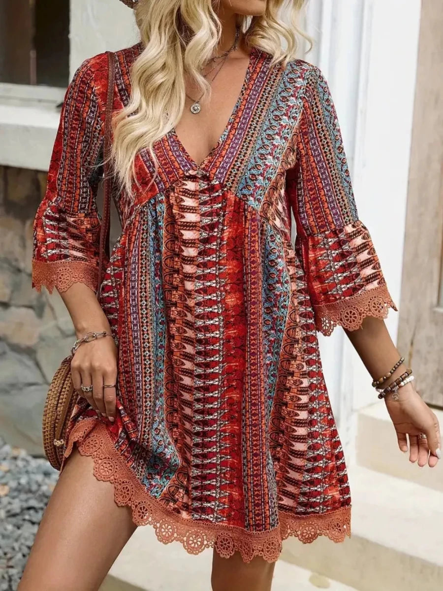 Soft floral print V-neck dress with lace trim and 3/4 sleeves on a woman model – Lace Trim Printed V-Neck 3/4 Sleeve Dress