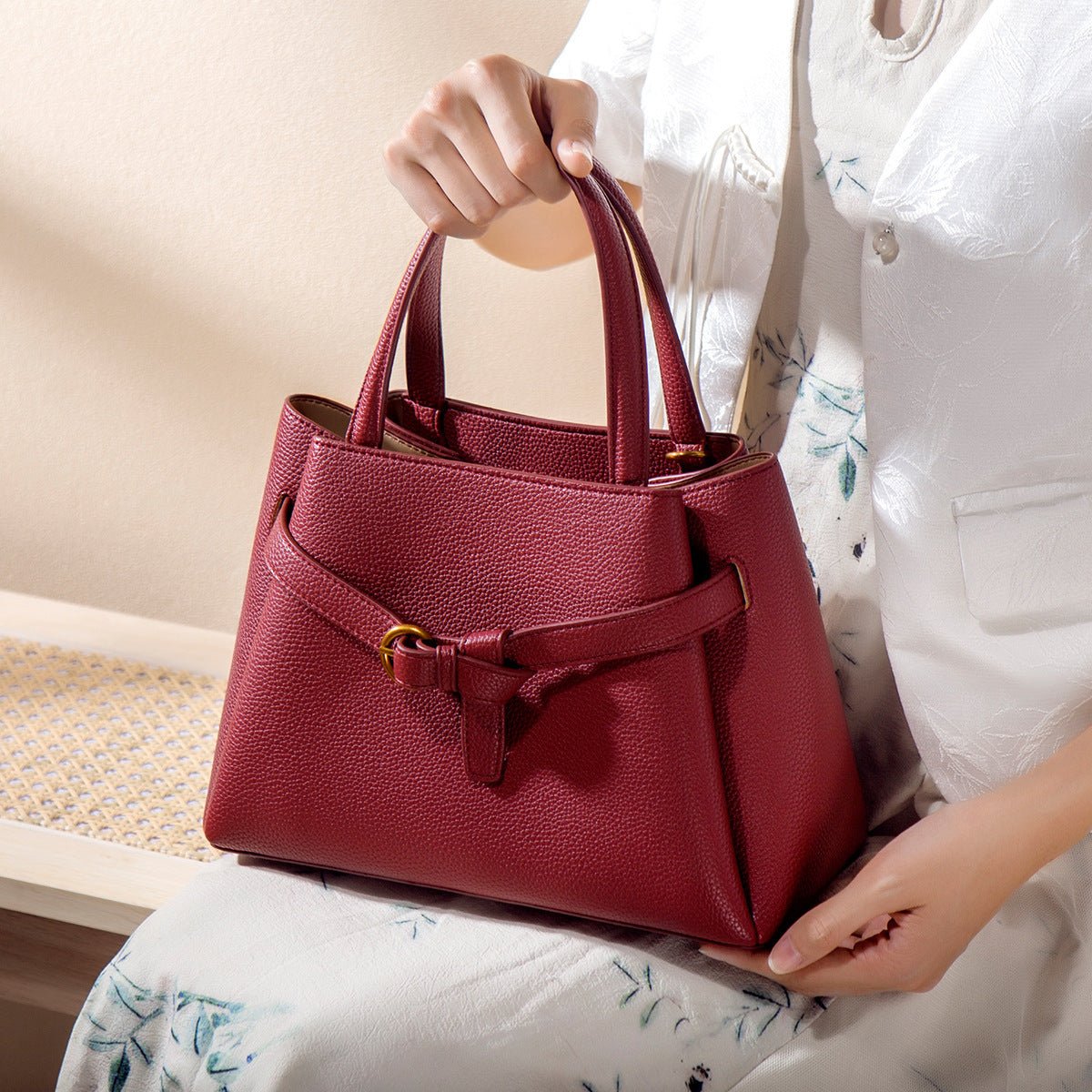 Brown genuine leather top handle handbag with gold-tone hardware and spacious interior