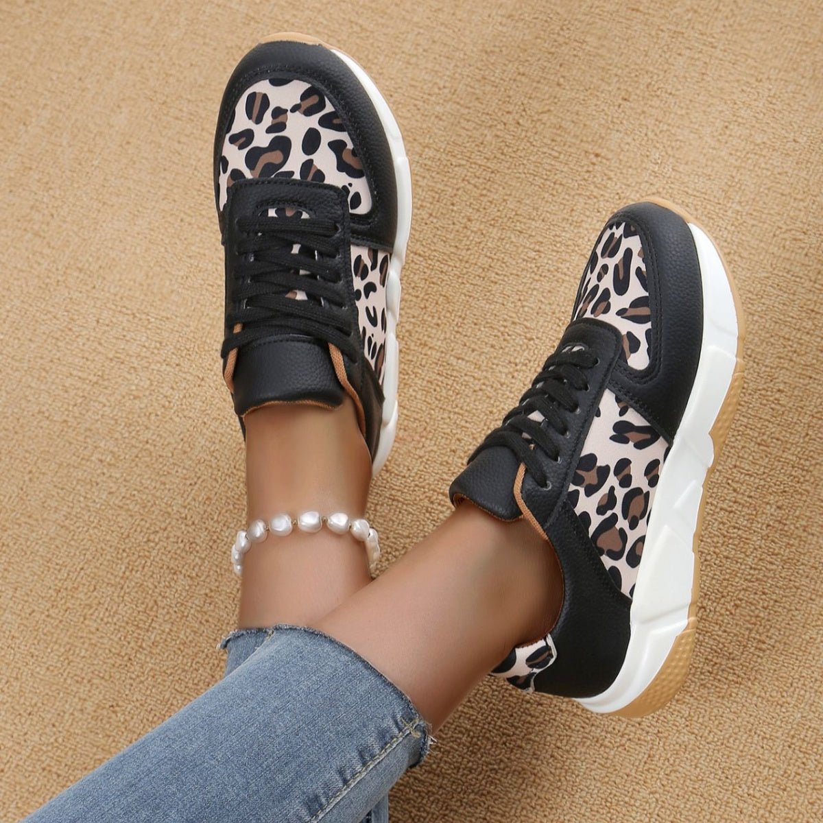Women's leopard print lace-up sneakers on a white background – bold animal print footwear