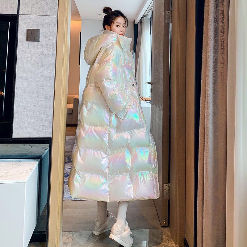 White puffer coat worn in a hallway, front view with the hood down