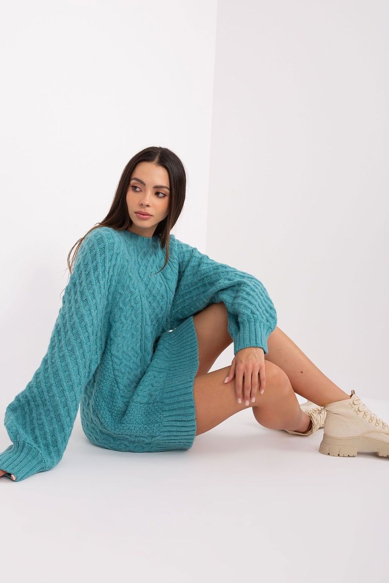 Oversized long jumper sweater in soft blue knitwear with relaxed fit and modern draped silhouette