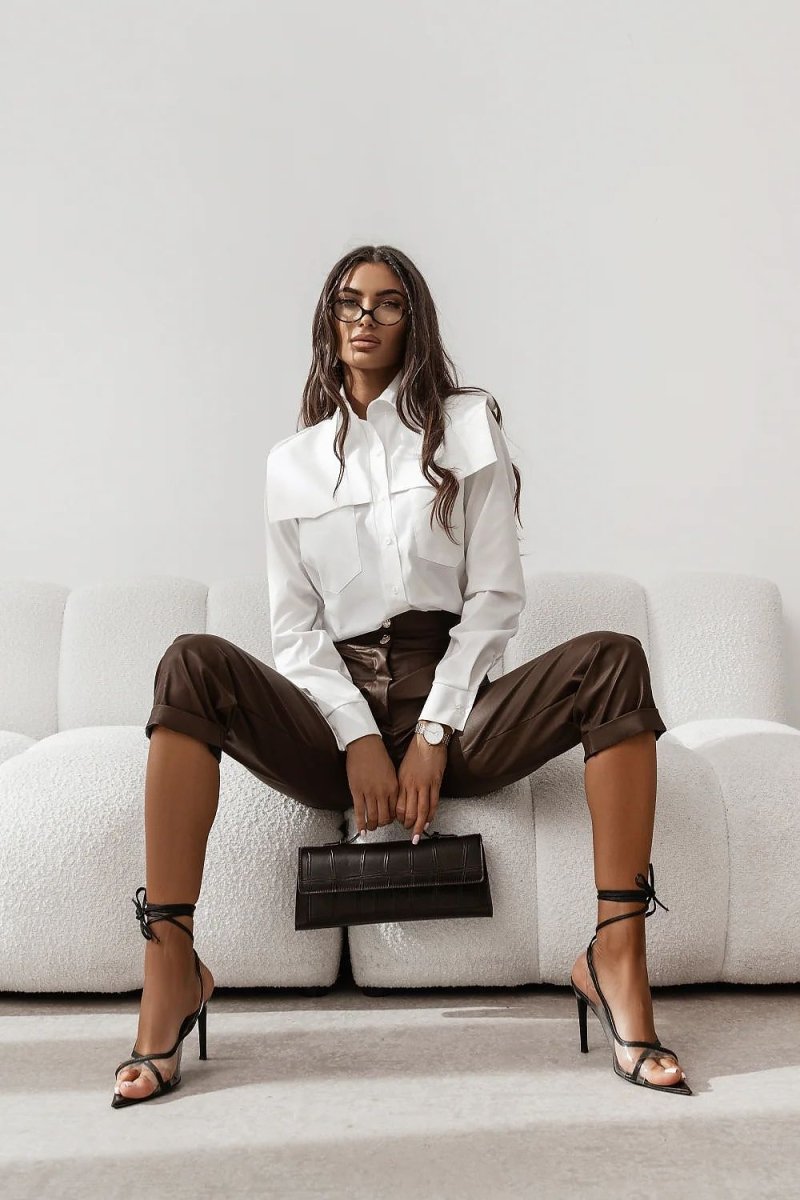 Model wearing beige cotton-elastane shirt in casual setting