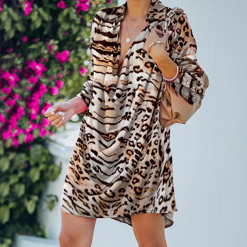 Leopard print dress worn with a tan shoulder bag