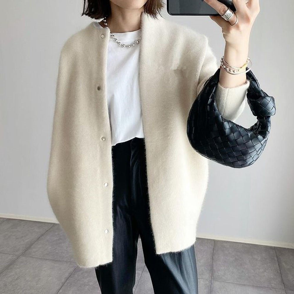 Loose knit cardigan coat in cream, front view on model, round neck, button front, knee-length, relaxed fit