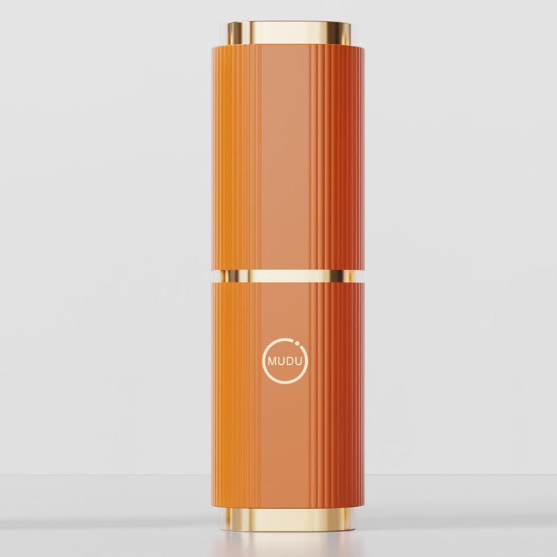 Orange fluted column with gold-tone rims and a round MUDU logo