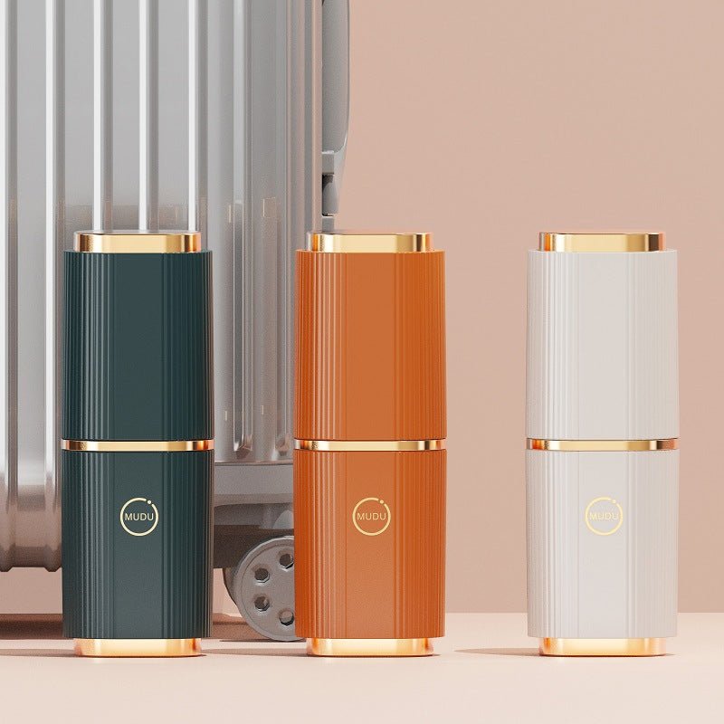 Closed dark teal, orange and white columns in front of a suitcase