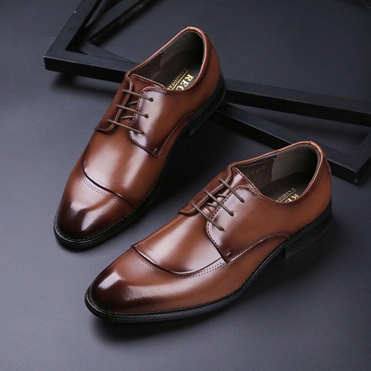 Pair of brown cap-toe lace-up shoes with a darker shaded toe, on a dark background