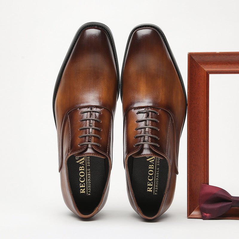 Brown lace-up shoes seen from above with RECOBA printed on the insoles