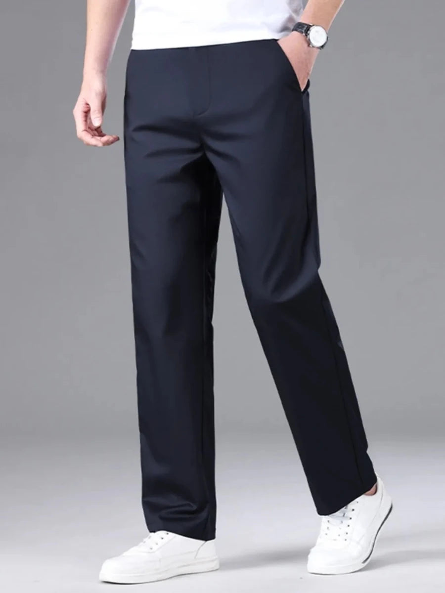 Men's loose fit casual pants in navy blue with relaxed silhouette and tapered leg, perfect for everyday wear