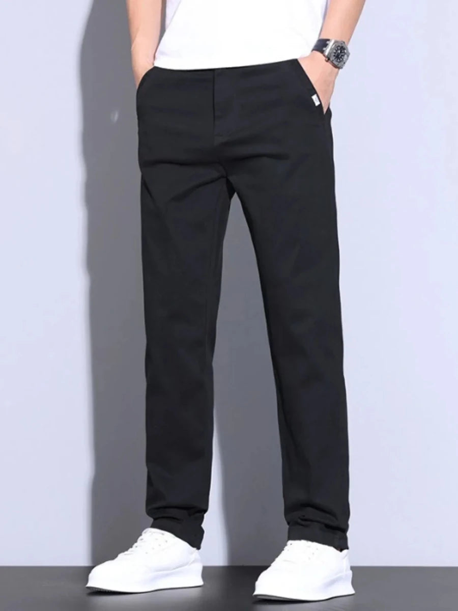 Man wearing loose-fit cotton pants in relaxed fit on city street – Men's Loose-Fit Comfort Casual Pants