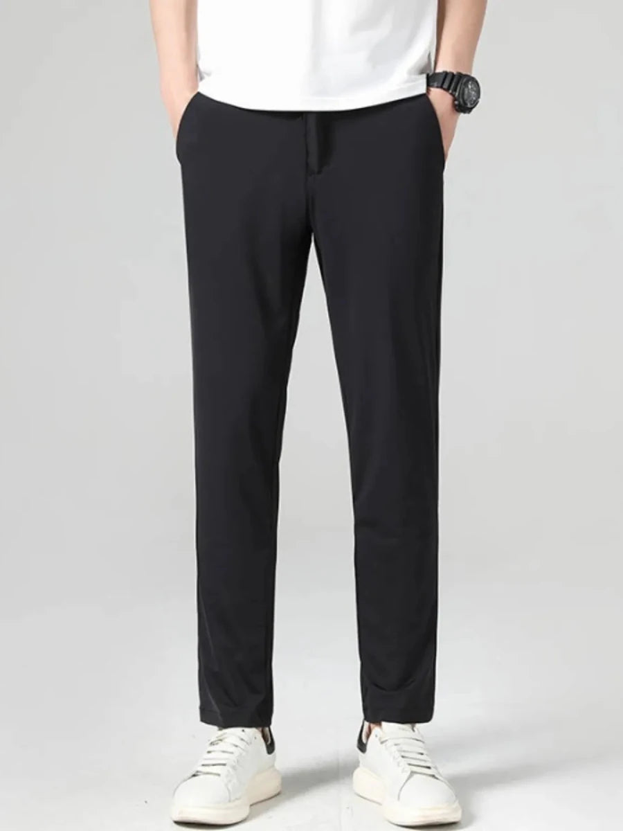 Men's loose fit cotton pants in khaki, relaxed silhouette with front pockets on a model