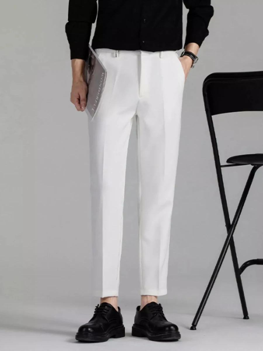 Men's slim fit chinos in navy stretch fabric, modern tailored fit with subtle texture