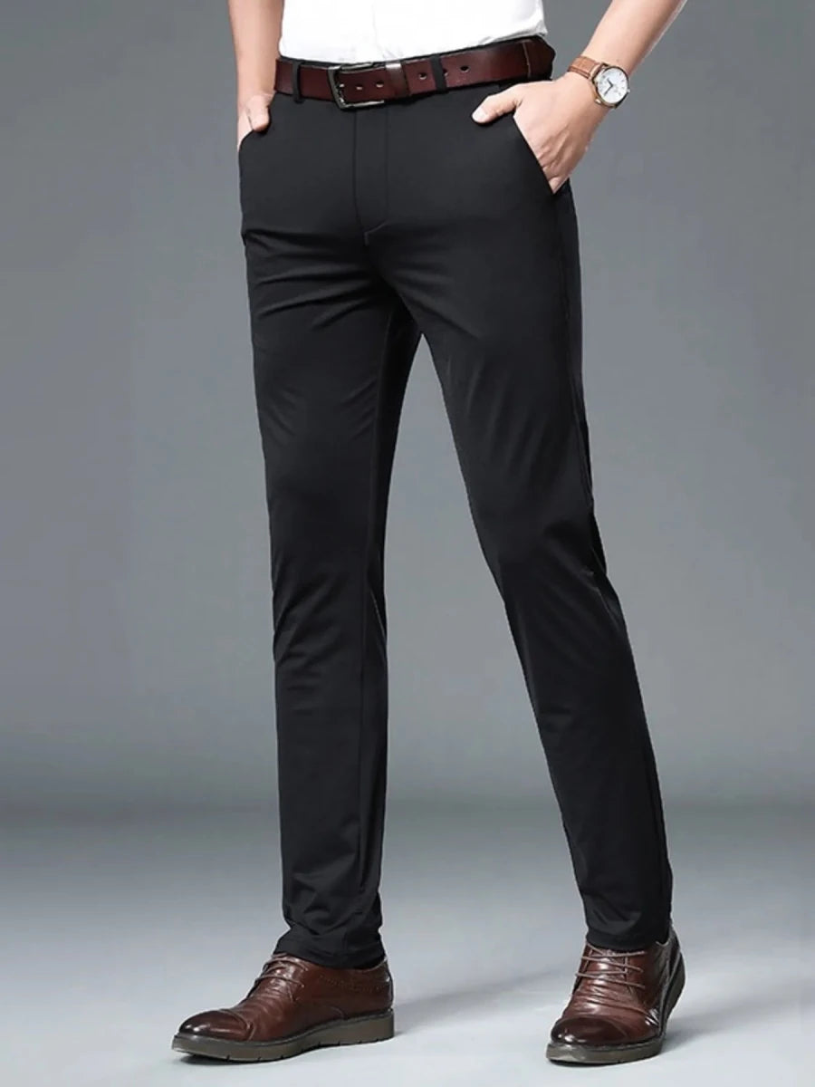 Men's slim fit chino pants in navy with stretch cotton blend fabric, modern tailored silhouette