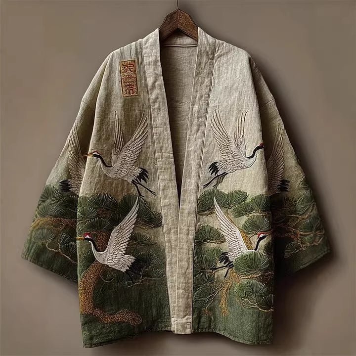 Kimono jacket, print cranes and pine trees in green and cream, on a hanger