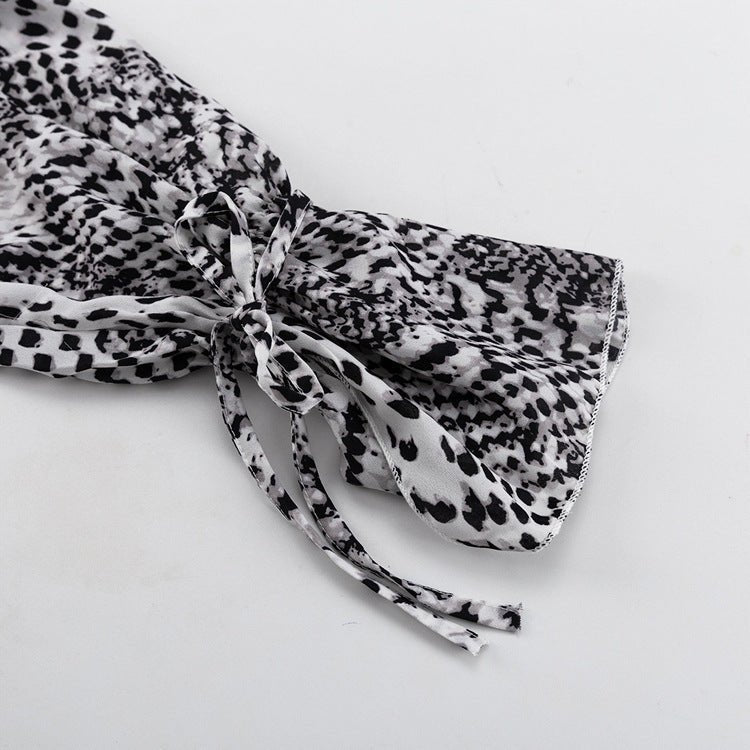 Close-up of a balloon sleeve gathered into a ruffled cuff with a tie