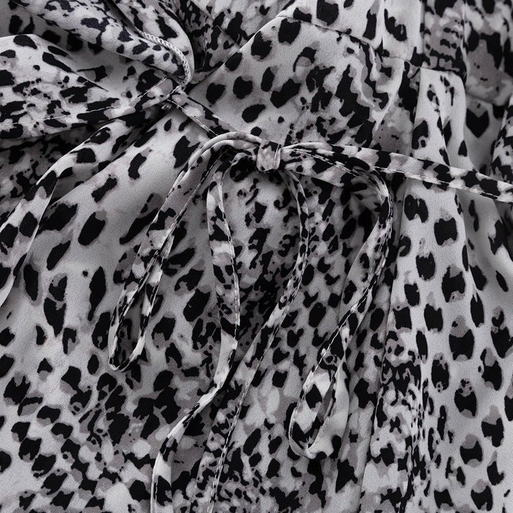 Close-up of the self-tie at the waist in the black and white print