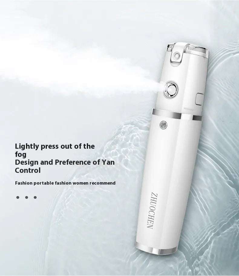 White handheld mist sprayer with ZHUOCHEN lettering, spraying mist